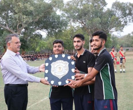 College Principal is awarding trophy 